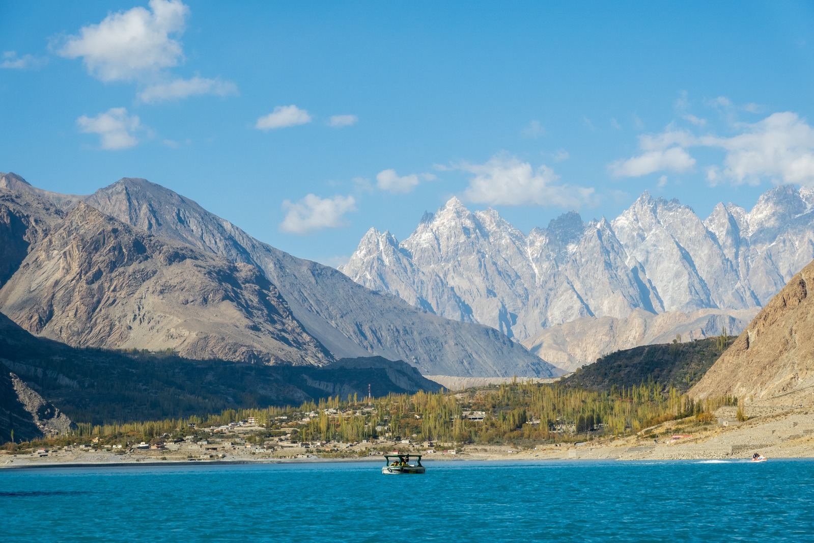 Turquoise lake below the granite spires of the Karakoram